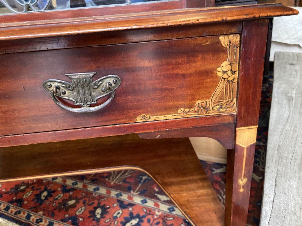 An Edwardian inlaid mahogany side table, the superstructure with an inset stained glass panel, width 95cm, depth 50cm, height 91cm